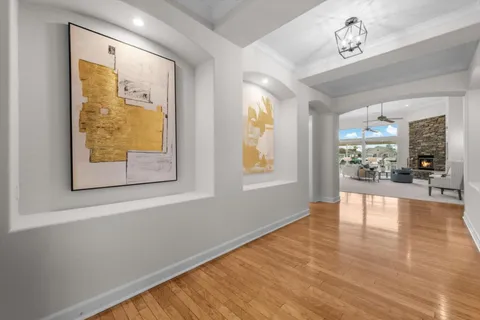 a view of an entryway with wooden floors