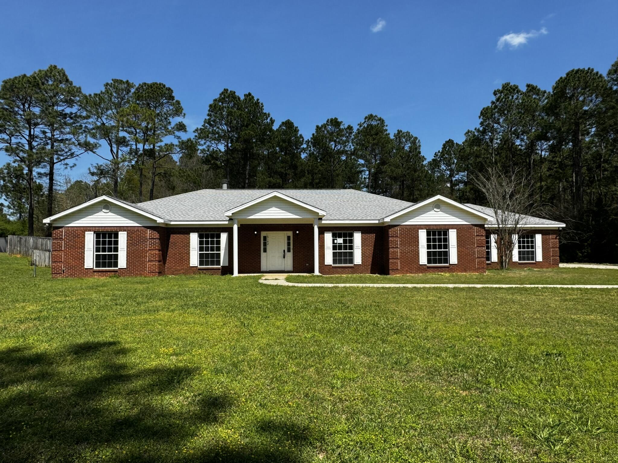 a front of a house with a yard