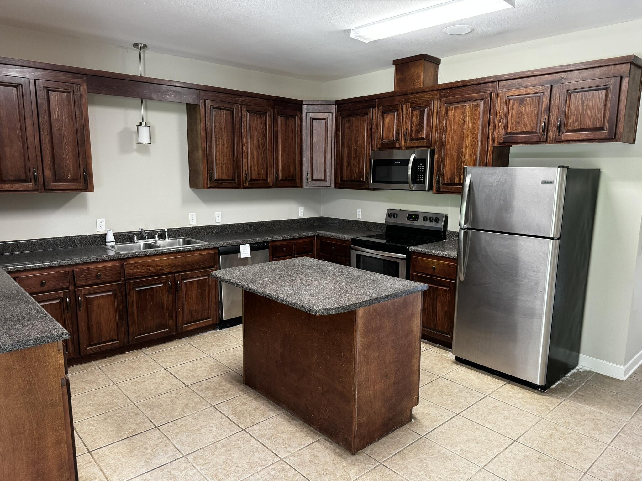6102 Holloway Road Baker, FL 32531 - Photo 18 of 28 a kitchen with stainless steel appliances granite countertop a stove a refrigerator and a sink