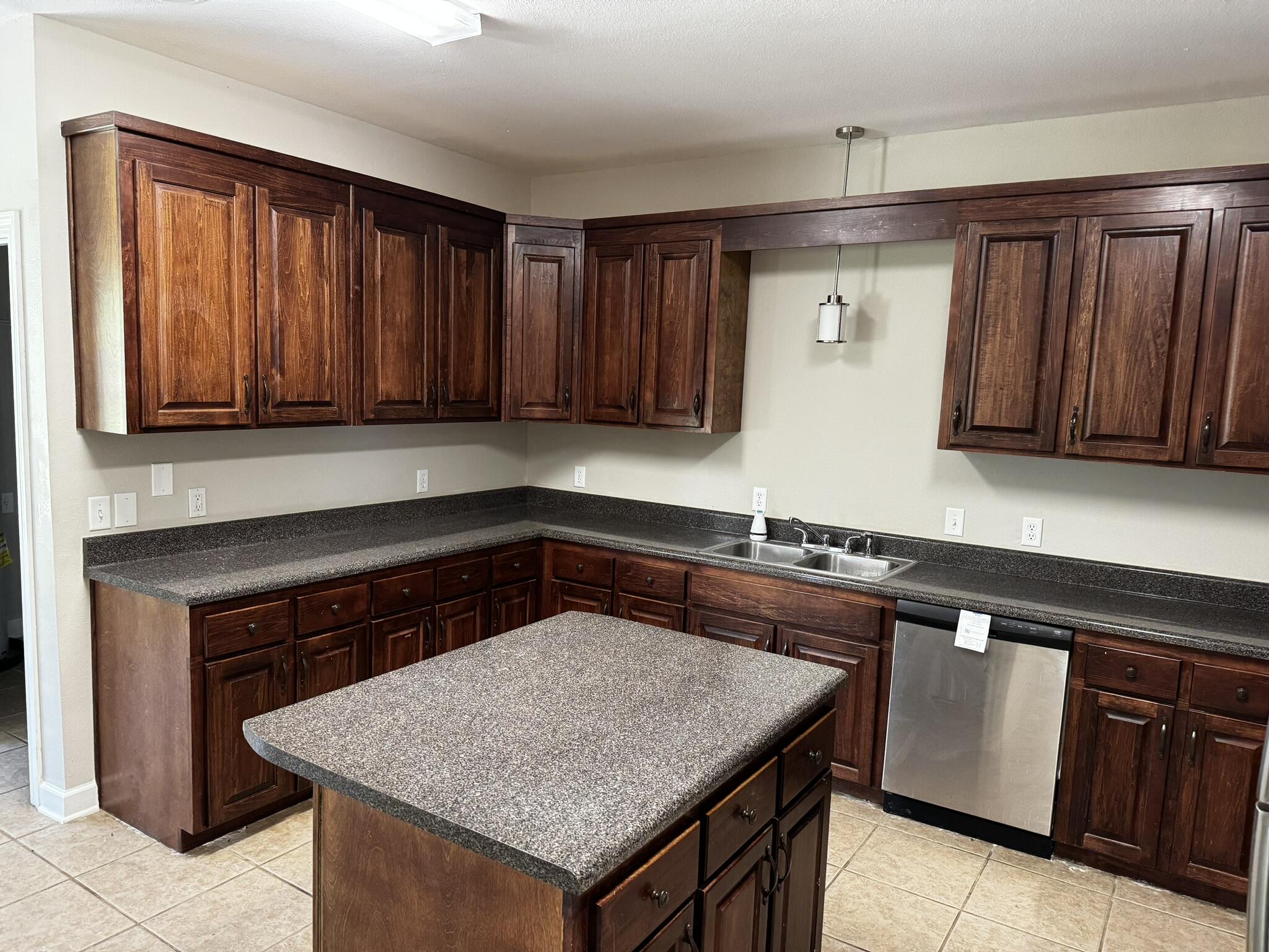 6102 Holloway Road Baker, FL 32531 - Photo 23 of 28 a kitchen with granite countertop a sink and a stove