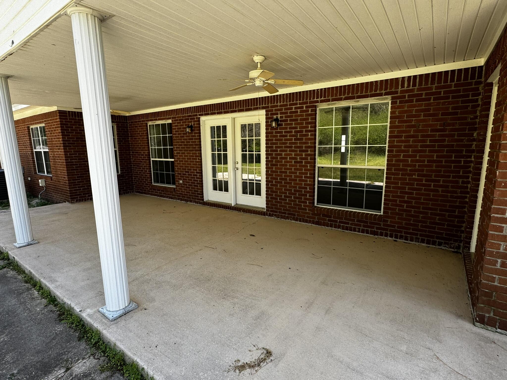 6102 Holloway Road Baker, FL 32531 - Photo 5 of 28 a view of a brick house with a large window