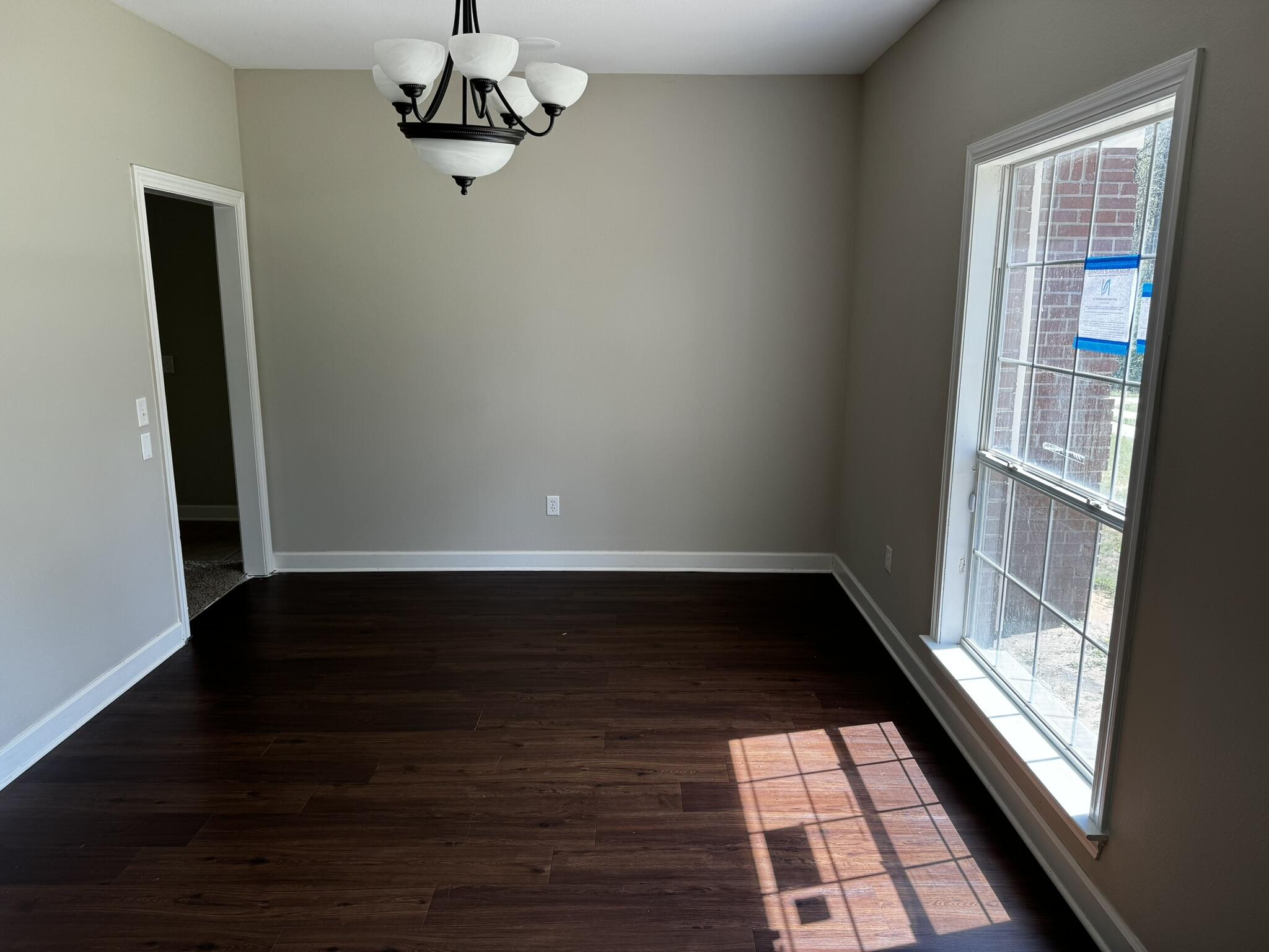 6102 Holloway Road Baker, FL 32531 - Photo 8 of 28 wooden floor in an empty room with a window
