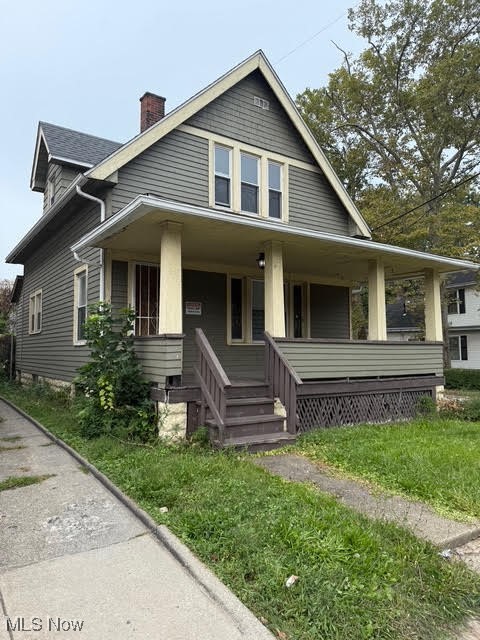 4372 Turney Road Cleveland, OH 44105 - Photo 1 of 16 View of front facade with covered porch and a chimney