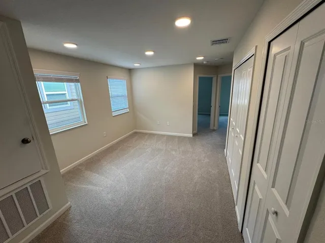 a view of hallway with windows