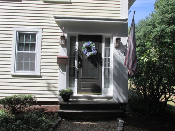 47 Locust Street Merrimac, MA 01860 - Photo 1 of 24 a front view of a house with plants