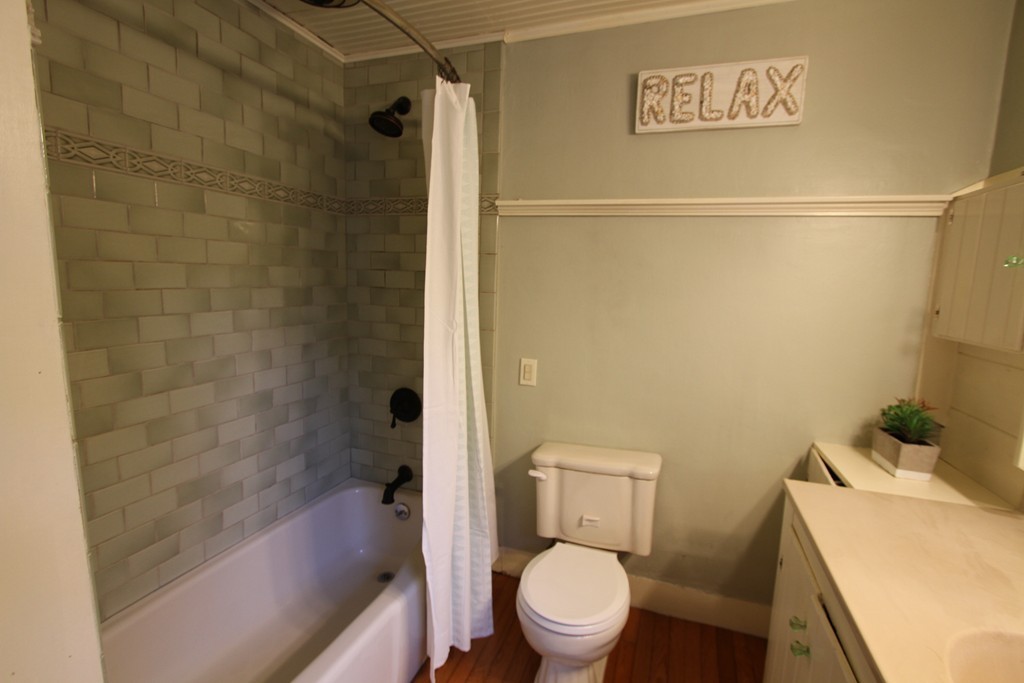 47 Locust Street Merrimac, MA 01860 - Photo 12 of 24 a white toilet sitting next to a bath tub