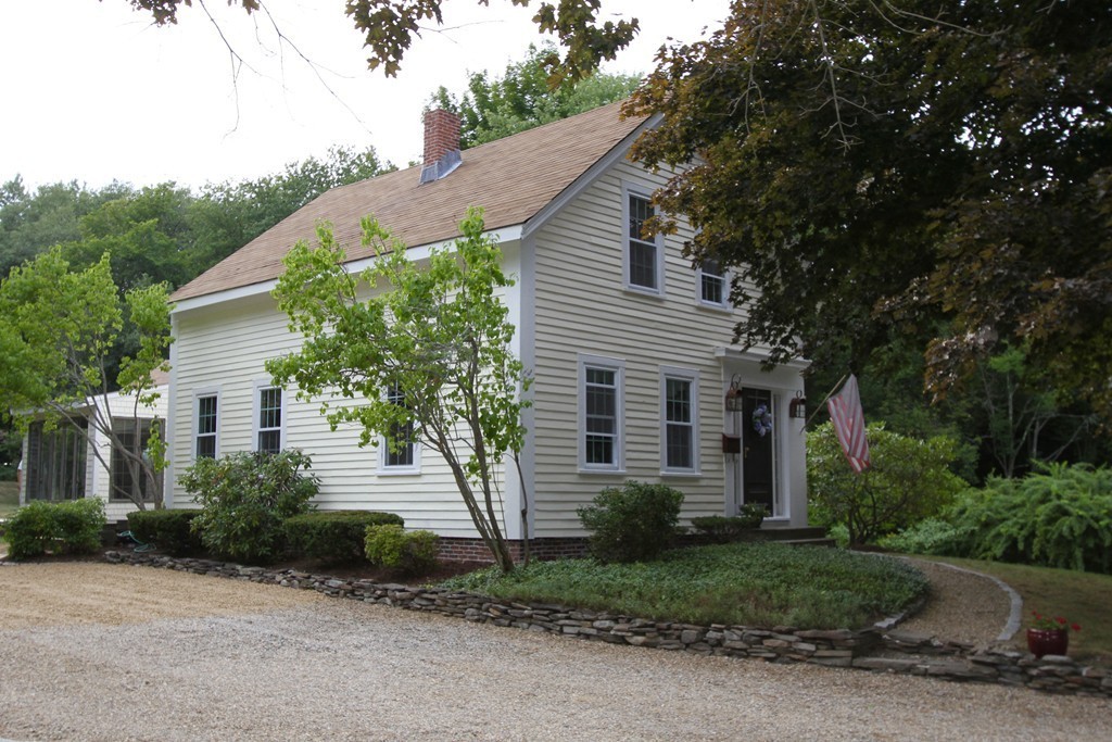 47 Locust Street Merrimac, MA 01860 - Photo 19 of 24 a front view of a house with a garden