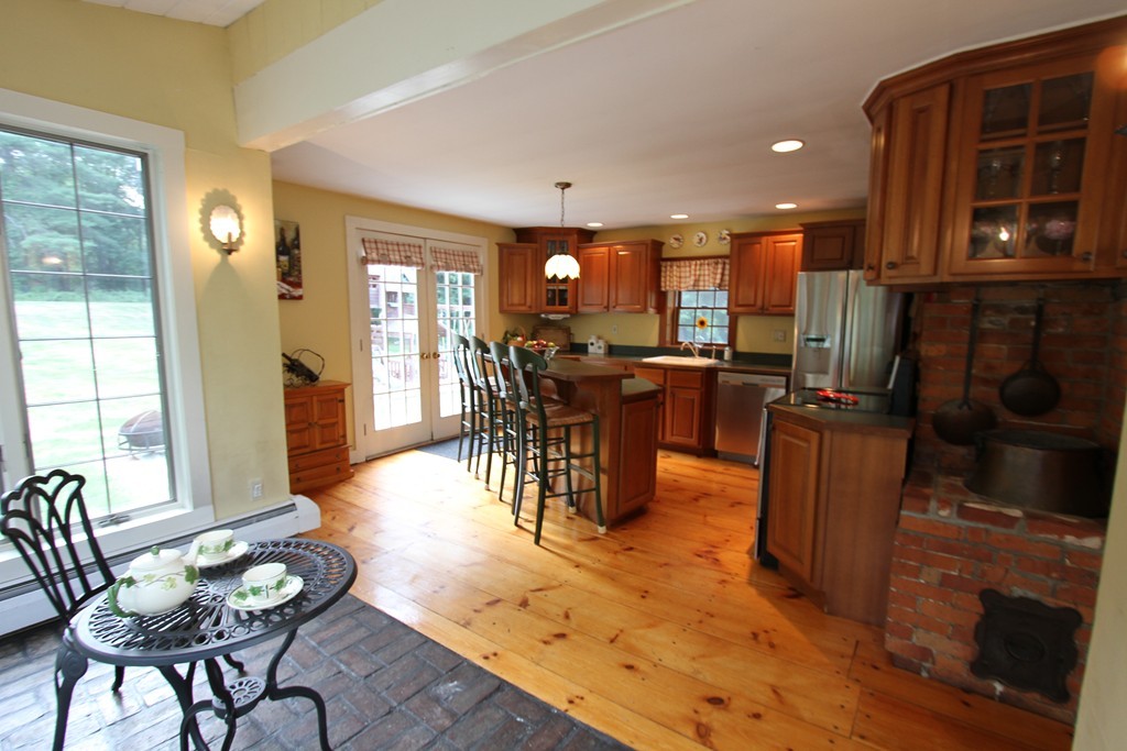 47 Locust Street Merrimac, MA 01860 - Photo 3 of 24 a view of a dining room with furniture window and wooden floor