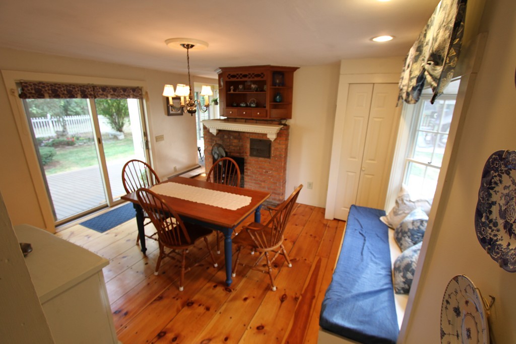 47 Locust Street Merrimac, MA 01860 - Photo 7 of 24 a view of a dining room with furniture and wooden floor