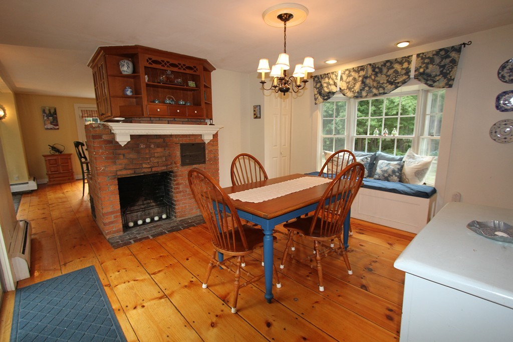 47 Locust Street Merrimac, MA 01860 - Photo 8 of 24 a view of a livingroom with furniture window and fireplace