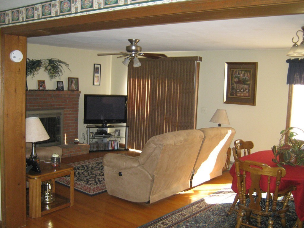 111 Brickyard Road, Unit A1 Athol, MA 01331 - Photo 5 of 15 a living room with furniture a flat screen tv and a fireplace