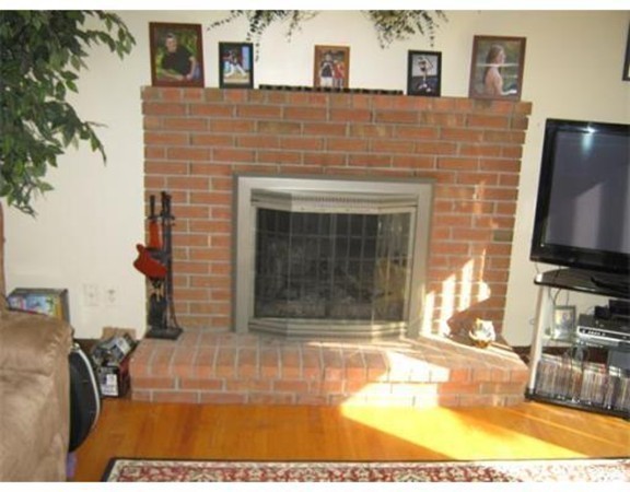 111 Brickyard Road, Unit A1 Athol, MA 01331 - Photo 6 of 15 a living room with fireplace furniture and a flat screen tv