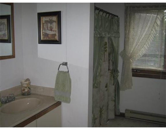 111 Brickyard Road, Unit A1 Athol, MA 01331 - Photo 7 of 15 a bathroom with a sink and mirror