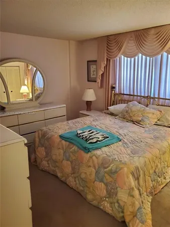 a bathroom with a toilet sink vanity and mirror