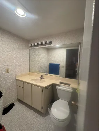 a bathroom with a shower and a toilet