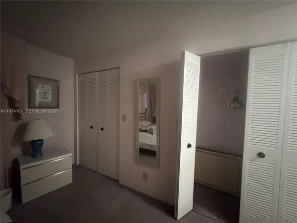 a bedroom with two beds and a couch