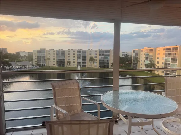 a room with wooden floor and a table