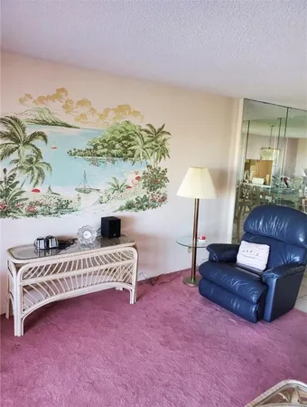 a living room with furniture and a lamp