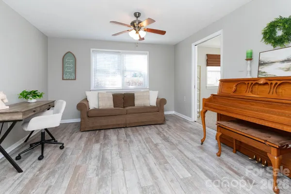 a living room with furniture and a window