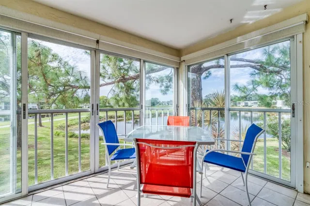 a view of a city from a dining room with large windows