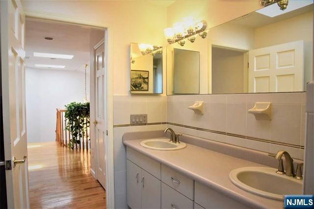 39 Irving Avenue Englewood Cliffs, NJ 07632 - Photo 17 of 31 a bathroom with a sink and a mirror