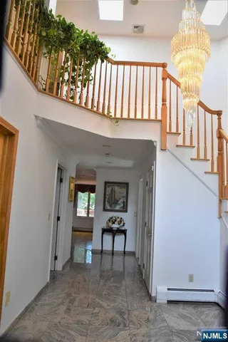 a view of a hallway with seating space