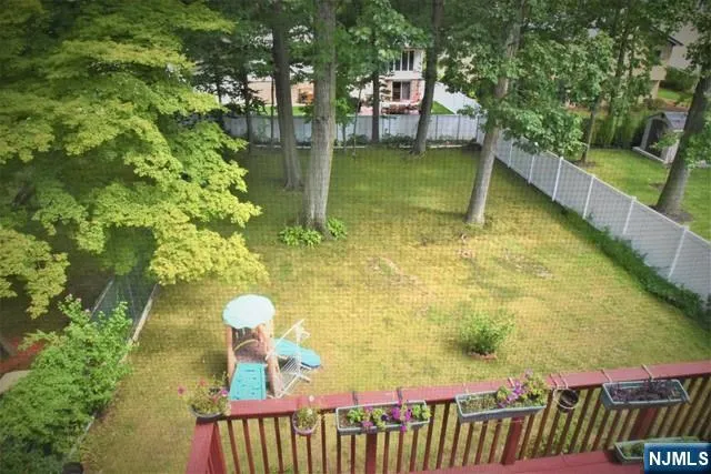 front view of a brick house with a yard