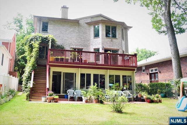 39 Irving Avenue Englewood Cliffs, NJ 07632 - Photo 30 of 31 front view of a brick house with a yard