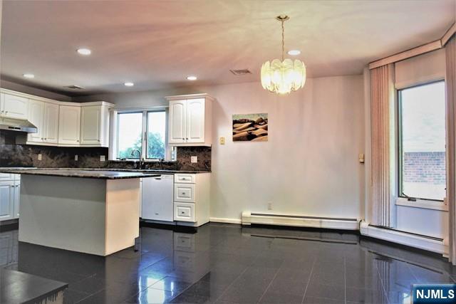 39 Irving Avenue Englewood Cliffs, NJ 07632 - Photo 5 of 31 a kitchen with a refrigerator and window
