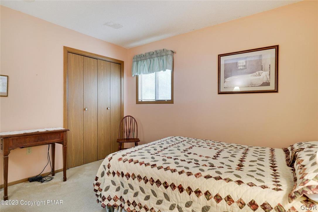 2150 Titania Road Tobyhanna, PA 18466 - Photo 16 of 31 a bedroom with a bed and a lamp on dresser