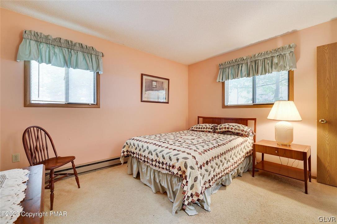 2150 Titania Road Tobyhanna, PA 18466 - Photo 17 of 31 a bedroom with a bed chair and window