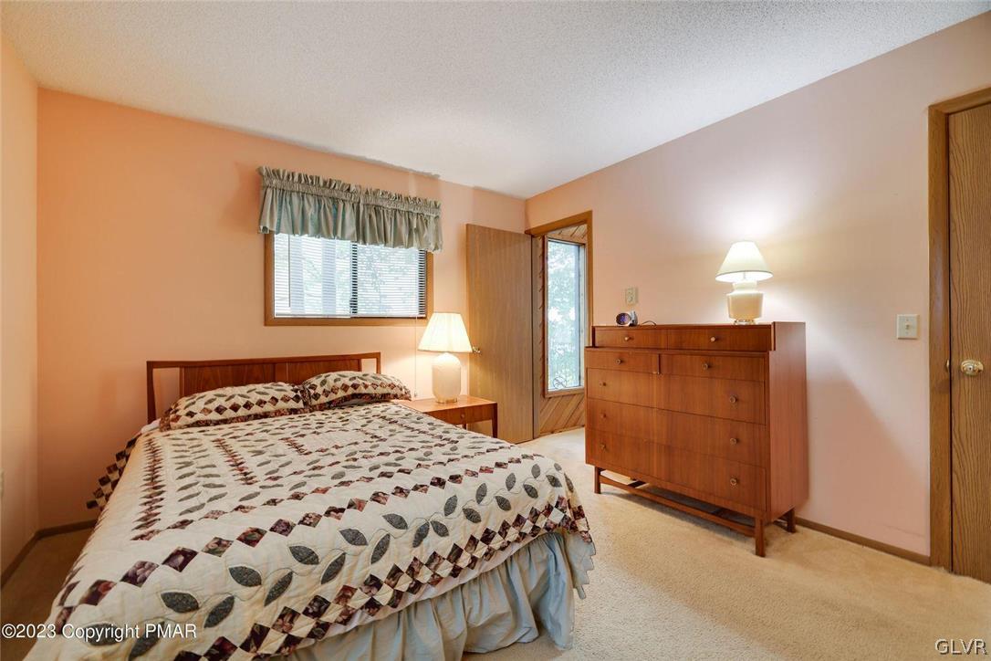 2150 Titania Road Tobyhanna, PA 18466 - Photo 18 of 31 a bedroom with a bed and wooden floor