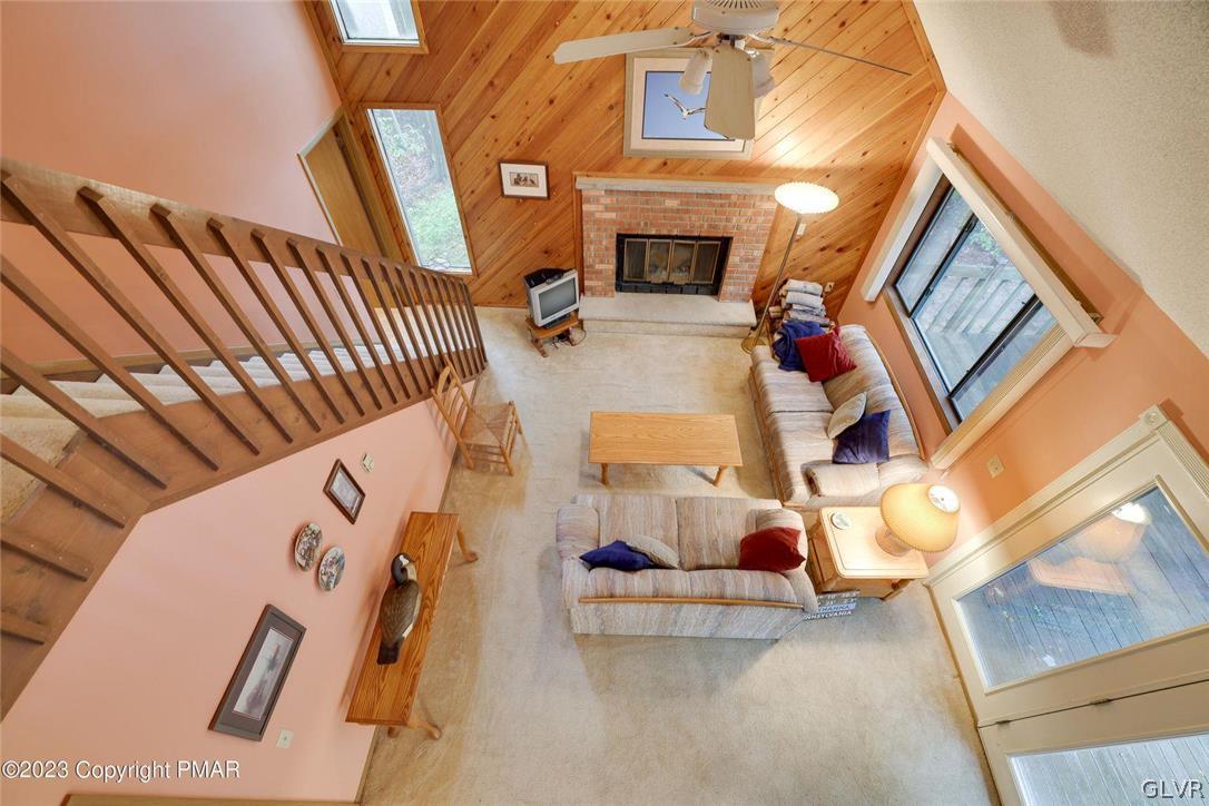 2150 Titania Road Tobyhanna, PA 18466 - Photo 20 of 31 with a living room with furniture and fireplace