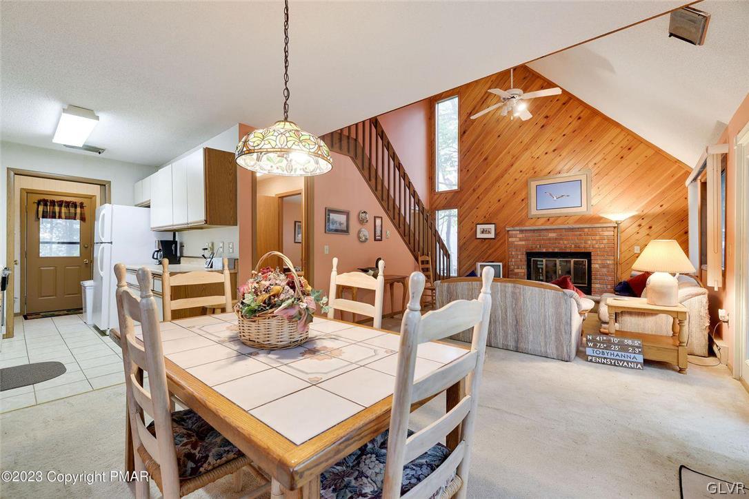 2150 Titania Road Tobyhanna, PA 18466 - Photo 2 of 31 a dining room with fireplace furniture and a chandelier