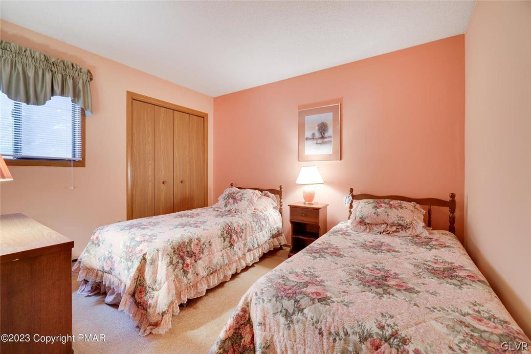2150 Titania Road Tobyhanna, PA 18466 - Photo 25 of 31 a bedroom with two beds and a lamp