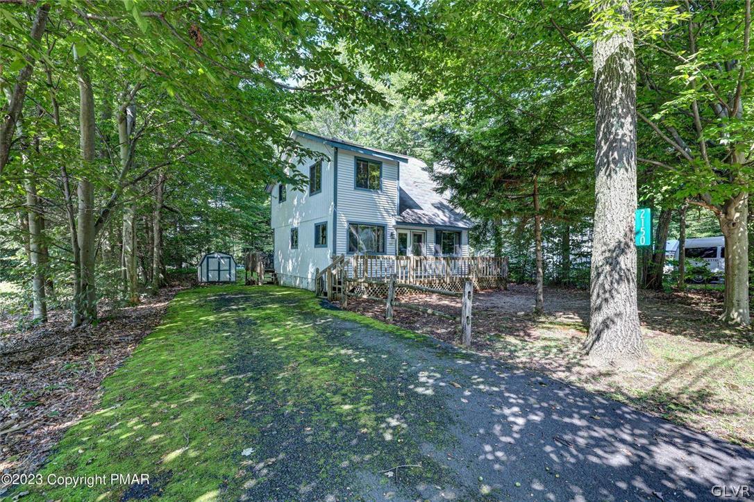 2150 Titania Road Tobyhanna, PA 18466 - Photo 30 of 31 a house view with a sitting space and garden