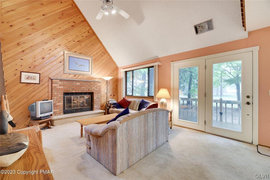 2150 Titania Road Tobyhanna, PA 18466 - Photo 4 of 31 a living room with furniture and a fireplace