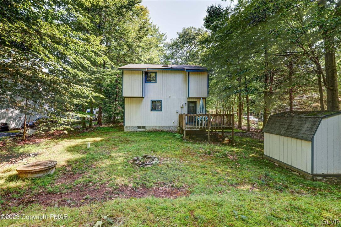 2150 Titania Road Tobyhanna, PA 18466 - Photo 5 of 31 a view of backyard of house with wooden fence