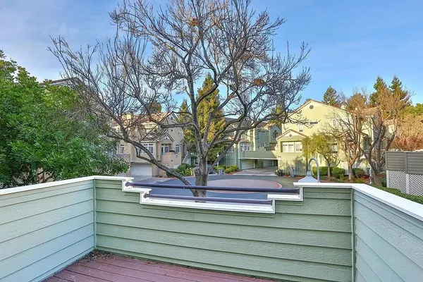 a view of outdoor space with deck and kitchen view