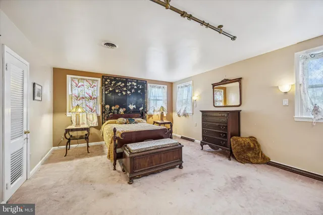 a living room with furniture a couch and a flat screen tv