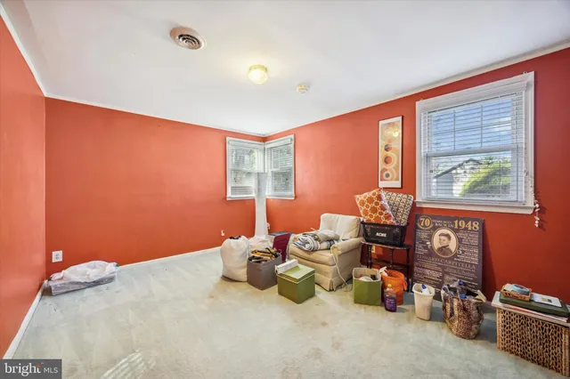 a bedroom with bed and a window