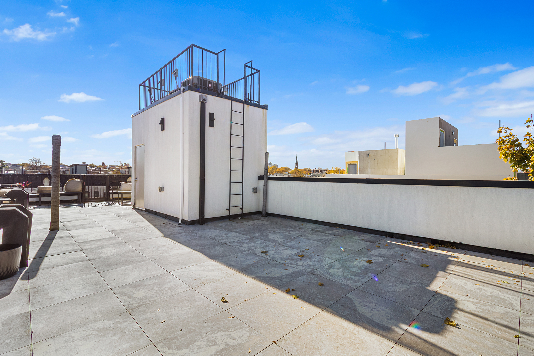 473 Bainbridge Street, Unit 2B Brooklyn, NY 11233 - Photo 14 of 15 a view of a terrace with a bench