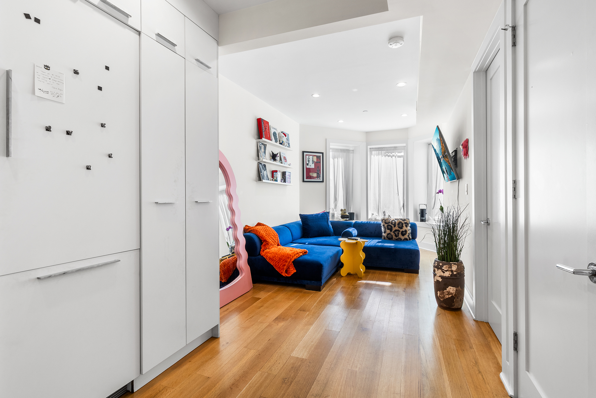 473 Bainbridge Street, Unit 2B Brooklyn, NY 11233 - Photo 4 of 15 a living room with furniture and wooden floor
