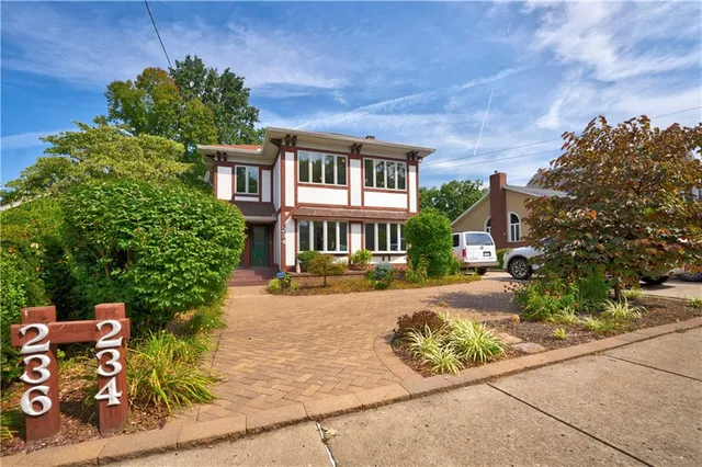 front view of a house with a yard