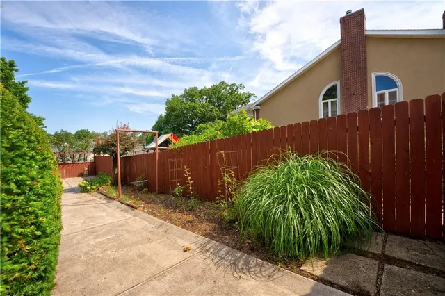 a backyard of a house with lots of green space