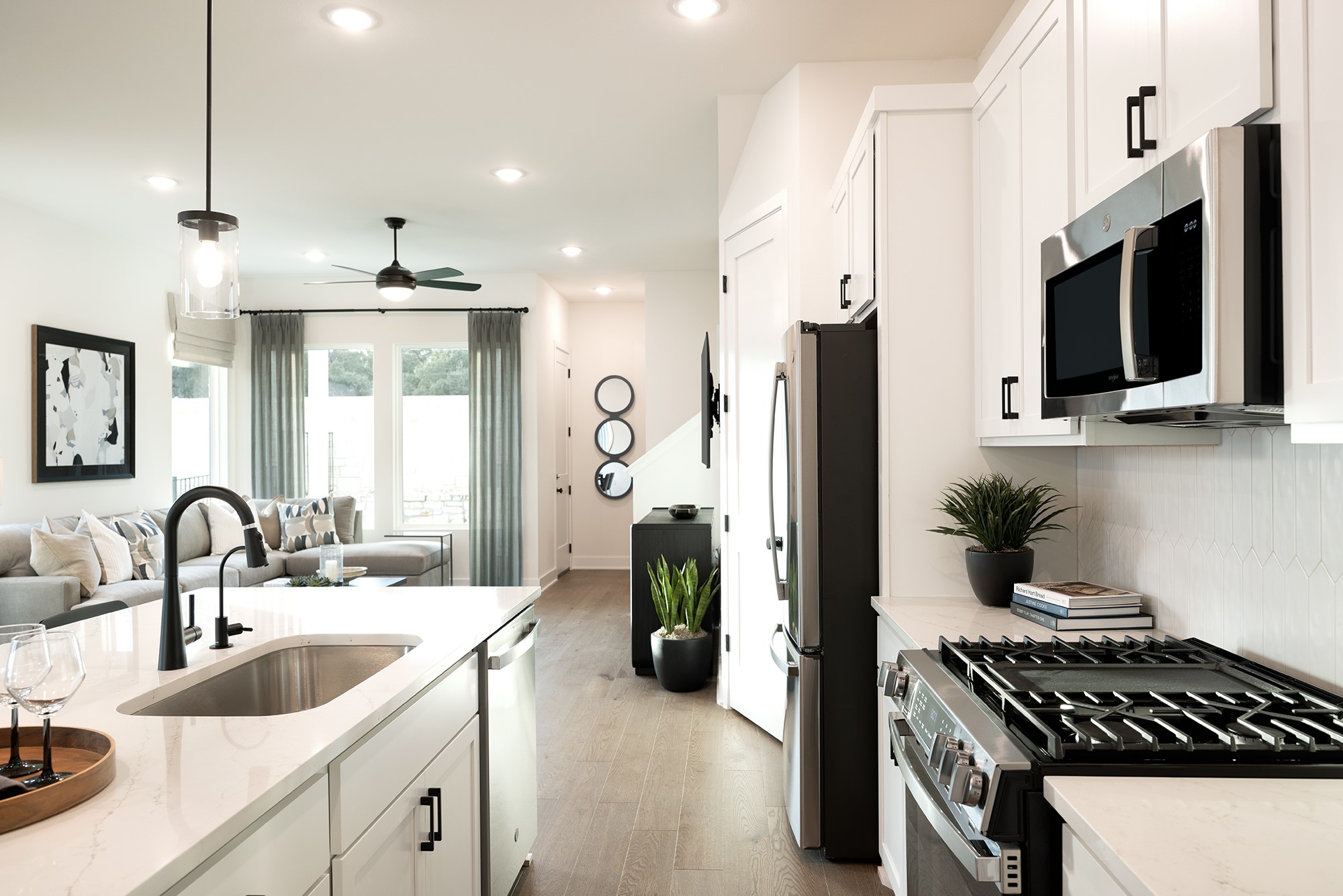 1320 Sweet Bark Street Austin, TX 78745 - Photo 7 of 13 a kitchen with a sink and stainless steel appliances