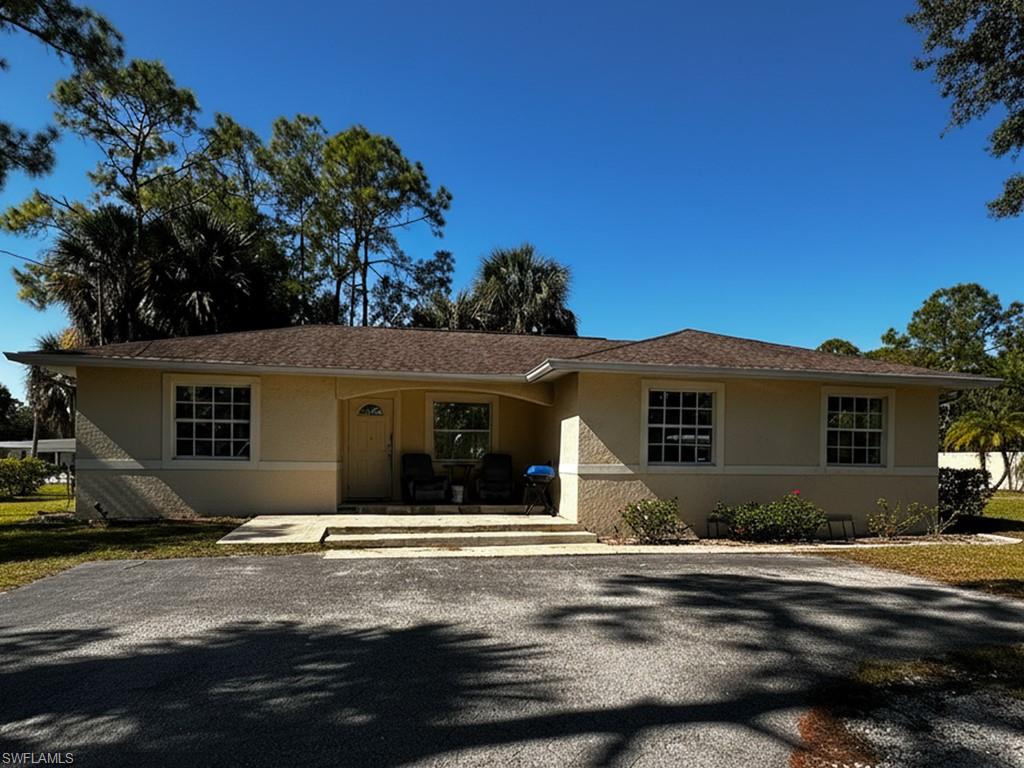 231 14th Street Northeast Naples, FL 34120 - Photo 1 of 13 Ranch-style house with stucco siding