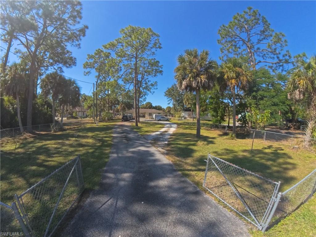 231 14th Street Northeast Naples, FL 34120 - Photo 12 of 13 Driveway and fencing