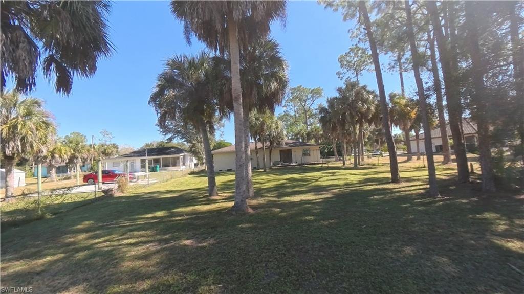 231 14th Street Northeast Naples, FL 34120 - Photo 13 of 13 View of home from the back yard