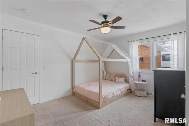 a kitchen with stainless steel appliances granite countertop a refrigerator and a stove